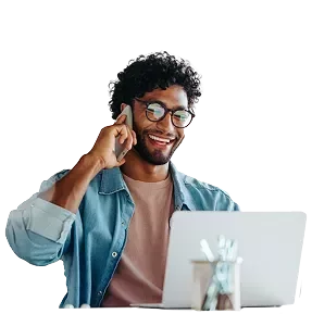 smiling man wearing a light brown shirt on a light gray background