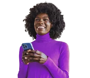 smiling woman wearing a purple shirt on a light gray blue background