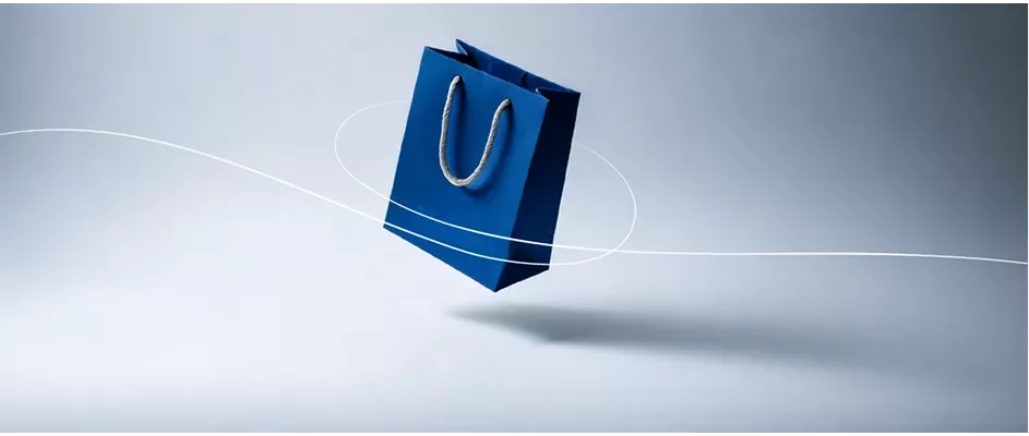 A shopping bag in a white and gray gradient background